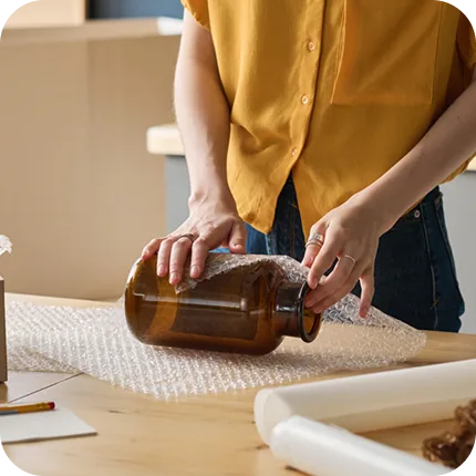 Protective bubble layer goes onto a glass bottle.